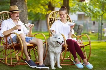 Image showing Happy couple at barbecue dinner on sunset time