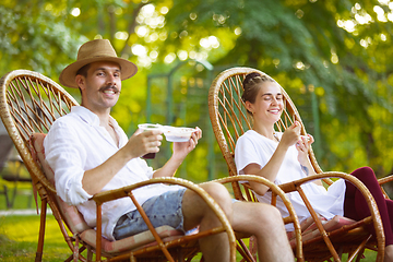 Image showing Happy couple at barbecue dinner on sunset time