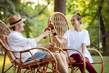 Image showing Happy couple at barbecue dinner on sunset time