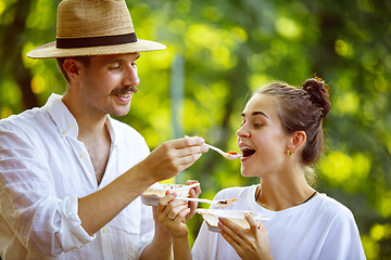 Image showing Happy couple at barbecue dinner on sunset time