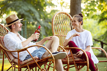 Image showing Happy couple at barbecue dinner on sunset time