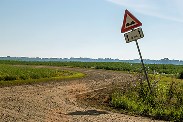 Image showing Road sign next to the rural road.