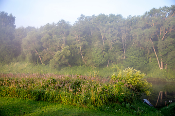 Image showing Landscape with mist on river bank.