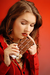 Image showing A girl with a chocolate