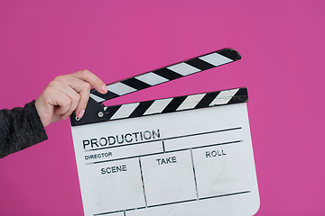 Image showing movie clapper on pink background