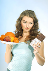 Image showing A woman with fruits and chocolate