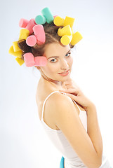 Image showing A woman in hair curlers