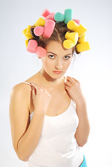 Image showing A woman in hair curlers