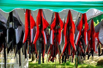 Image showing Life jackets drying in the shed.