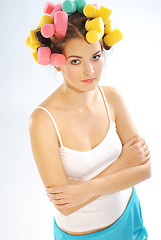 Image showing A woman in hair curlers