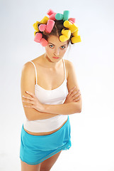 Image showing A woman in hair curlers