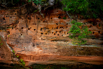 Image showing Red sandstone cliff near the river.