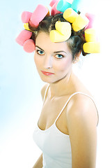 Image showing A woman in hair curlers