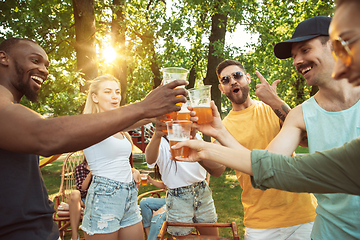 Image showing Happy friends are having beer and barbecue party at sunny day