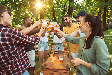 Image showing Happy friends are having beer and barbecue party at sunny day