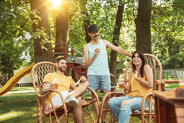 Image showing Happy friends are having beer and barbecue party at sunny day