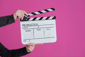 Image showing movie clapper on pink background