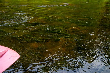 Image showing Reflections in shallow river as background.