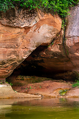 Image showing Red sandstone cliff on coast of the river 