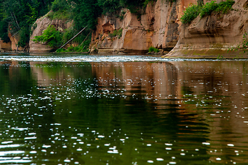 Image showing Red sandstone cliff on coast of the river 