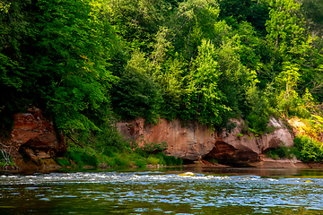 Image showing Red sandstone cliff on coast of the river 