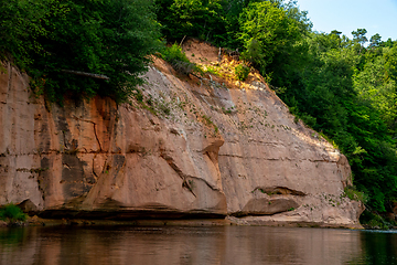 Image showing Red sandstone cliff on coast of the river 