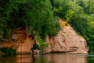 Image showing Red sandstone cliff on coast of the river 