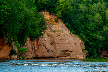 Image showing Red sandstone cliff on coast of the river 