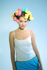 Image showing A woman in hair curlers