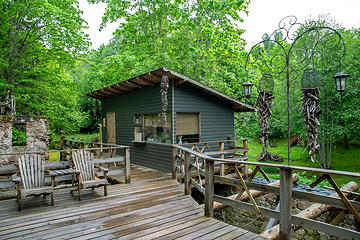 Image showing Wooden hut near to the trees