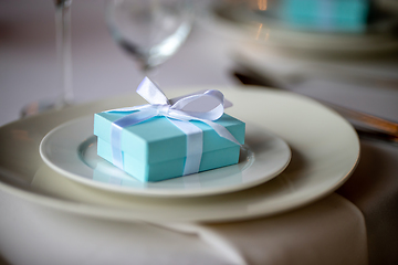 Image showing Light blue gift box on the plate