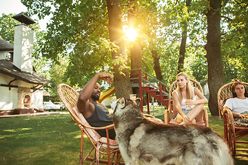 Image showing Happy friends are having beer and barbecue party at sunny day