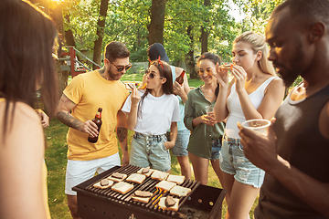 Image showing Happy friends are having beer and barbecue party at sunny day