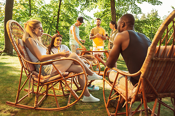 Image showing Happy friends are having beer and barbecue party at sunny day