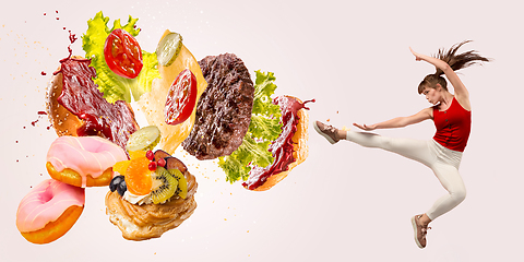 Image showing Burger\'s crashing by the boxer isolated on white background