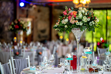 Image showing Wedding table decorated with flowers and dishes