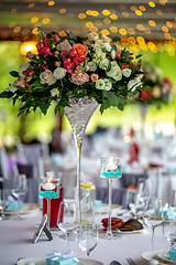 Image showing Wedding table decorated with flowers and dishes