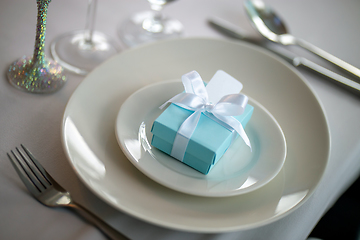 Image showing Light blue gift box on the plate