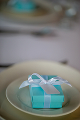 Image showing Light blue gift box on the plate