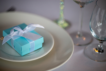 Image showing Light blue gift box on the plate