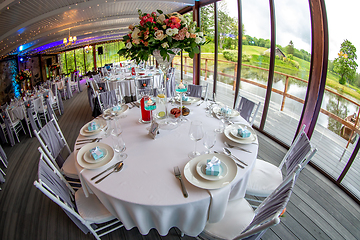 Image showing Tables setting for wedding party in restaurant