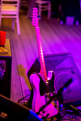 Image showing Guitar and sound amplifier in abstract light