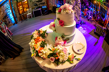 Image showing Decorated wedding cake on the table.
