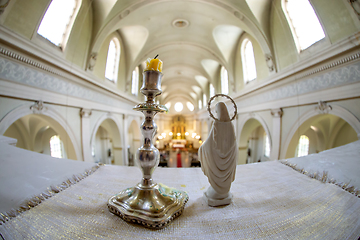 Image showing Statue of Virgin Mary and candlestick in church