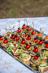 Image showing Wedding table with canapes and sandwiches