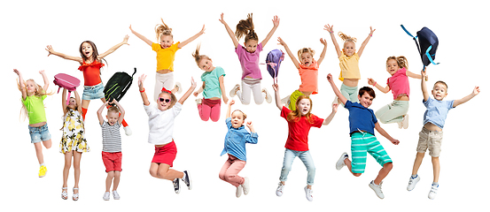 Image showing Group of elementary school kids jumping, back to school