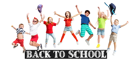 Image showing Group of elementary school kids jumping, back to school