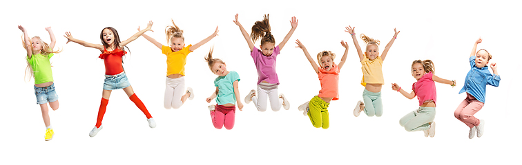 Image showing Group of elementary school kids jumping, back to school