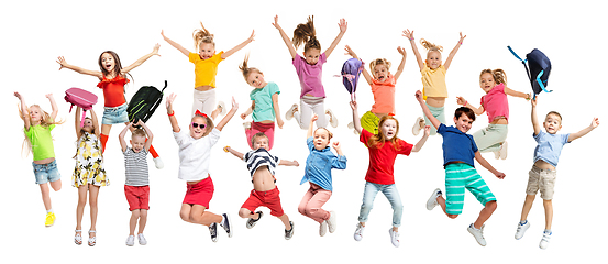 Image showing Group of elementary school kids jumping, back to school