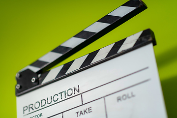 Image showing movie clapper on green  background